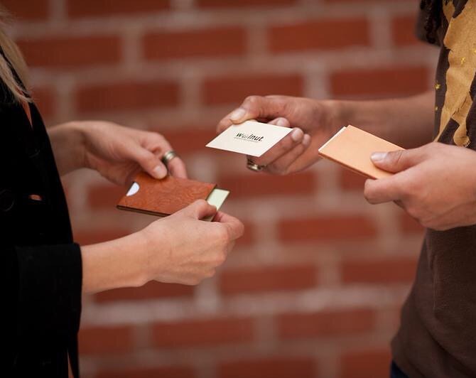 People exchanging business cards.