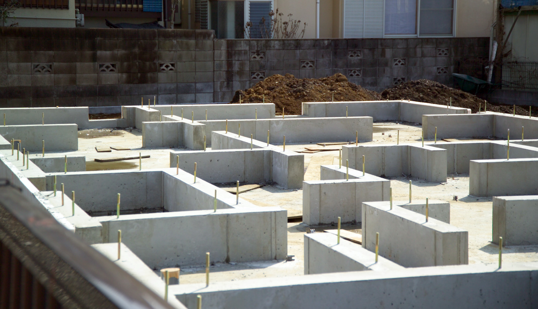 Image showing a house construction site with foundation completed.