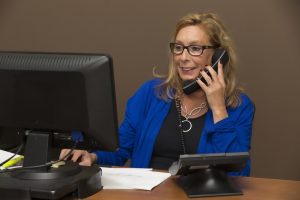A saleswoman on the phone.