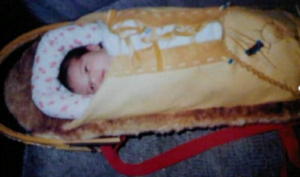 Indigenous infant wrapped in a cradleboard