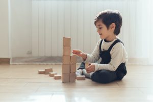 Block play area with assortment of soft blocks, cardboard building blocks  and shape sorters. Courtesy of …