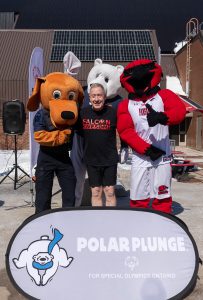 Fanshawe president with mascots for polar plunge