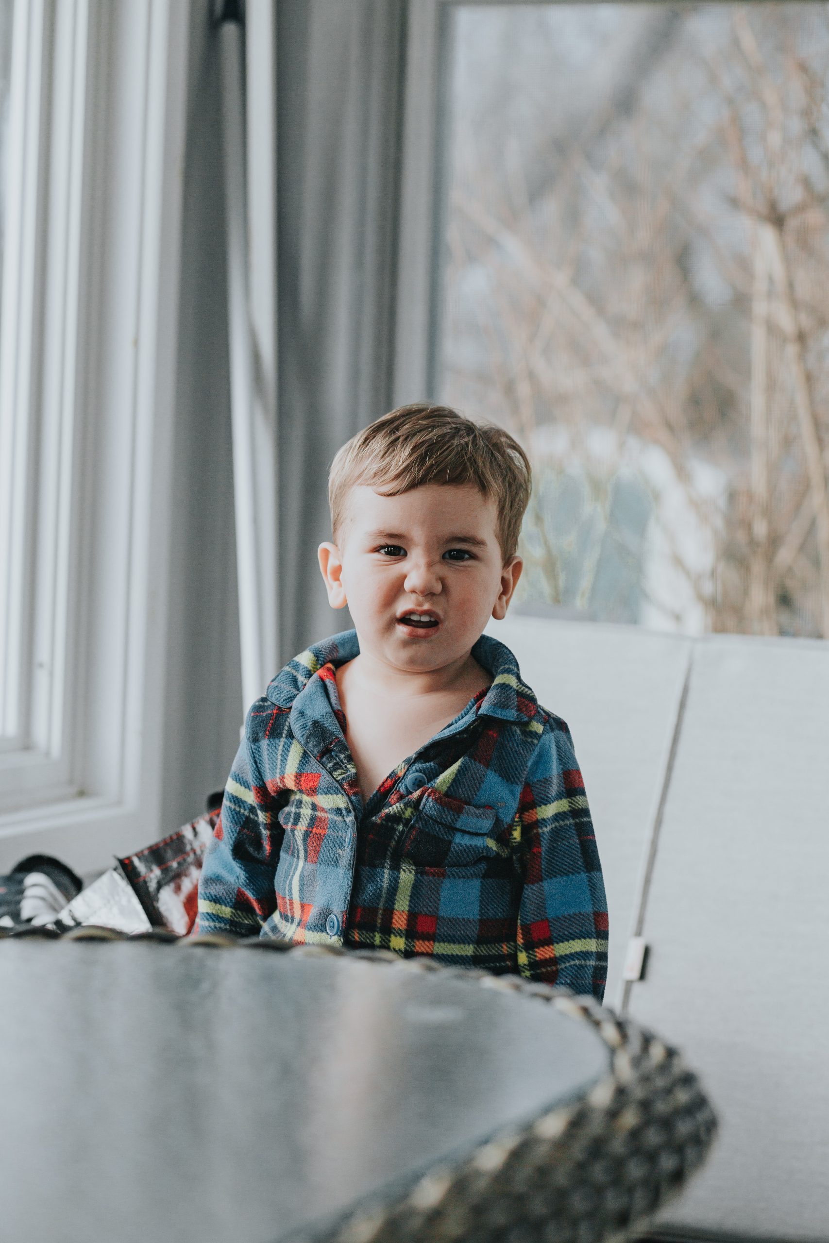 Boy behind table