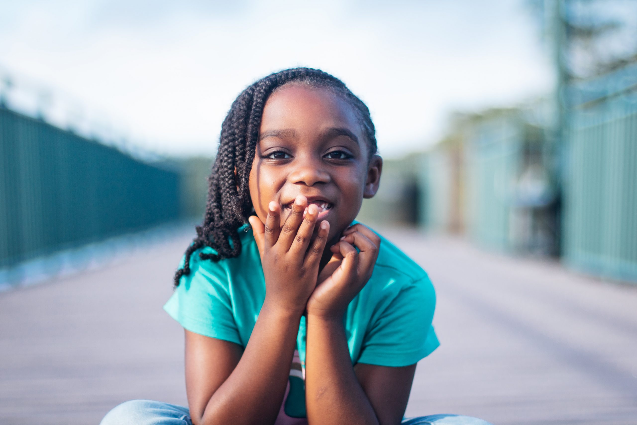 Young black girl in a green shirt