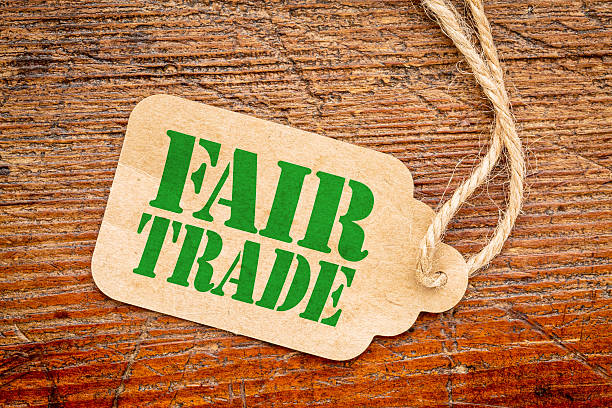 fair trade sign on a paper tag placed on the red painted wood