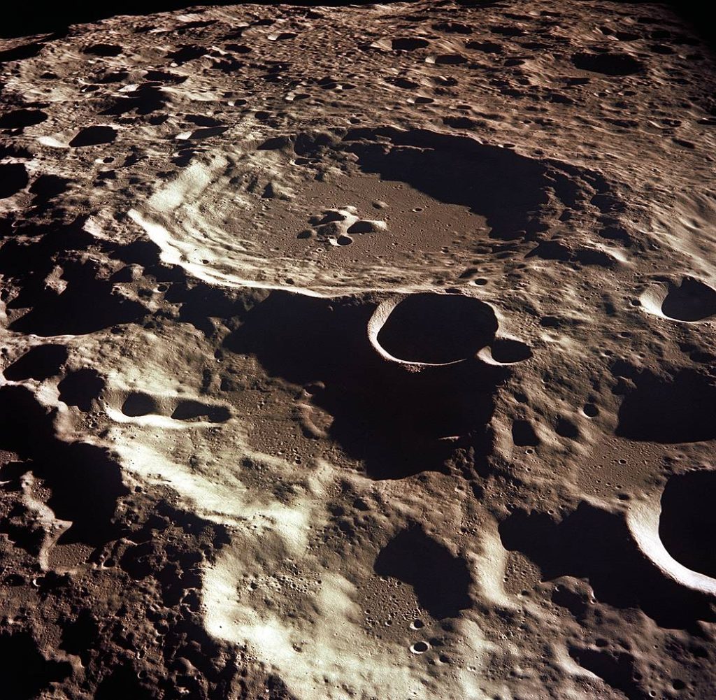 Photograph of Lunar Highlands. This image is dominated by countless overlapping craters of all sizes, which is typical of the Lunar highlands.