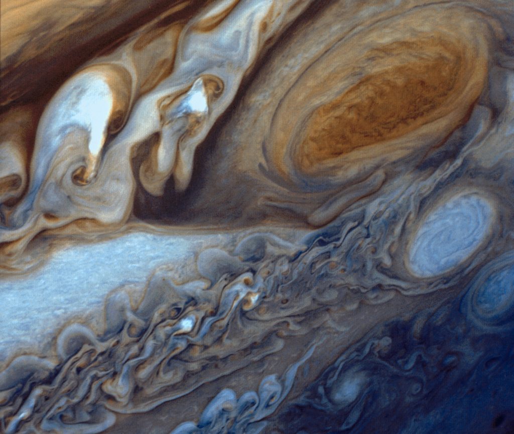 Jupiter’s Great Red Spot. A highly enhanced image from the Voyager probe showing the region with much greater colour contrast allowing much finer features and details to be discerned.