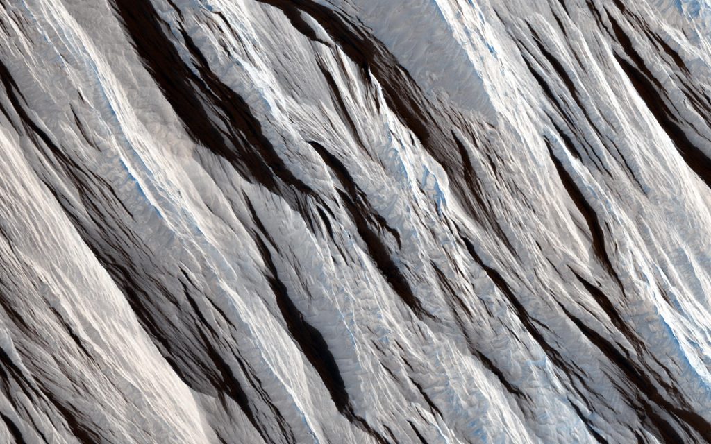 Image from Mars Reconnaissance Rover showing land formations formed by wind on the martian surface