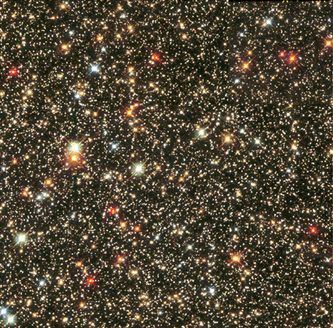 Hubble Space Telescope image of the Sagittarius Star Cloud. The image shows many stars of various colours, white, blue, red and yellow spread over a black background. The most common star colours in this image are red and yellow.