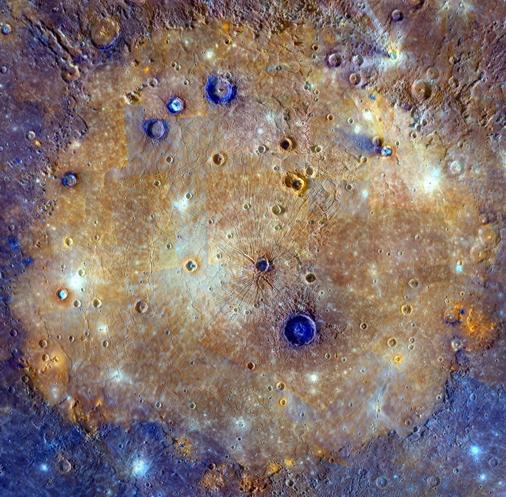 Photograph of the Caloris Basin on Mercury. The circular, flat plain of Caloris Basin is surrounded by cratered highlands and rough terrain. A few impact craters are scattered over the smooth surface of the basin.