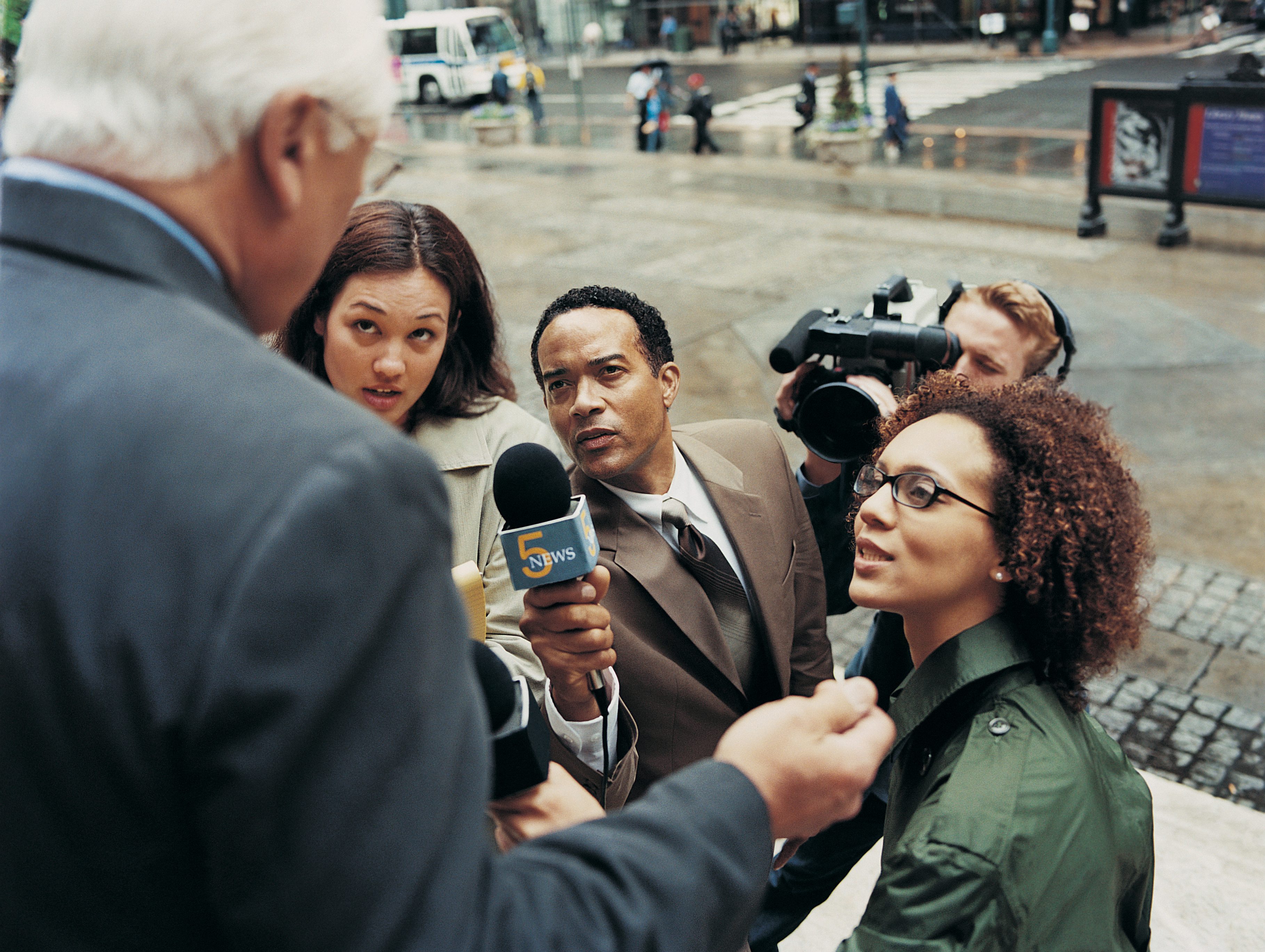 "News Reporters and a TV Cameraman" by Digital Vision is licensed under CC BY 2.0.