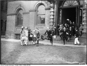 Students running out of a school door