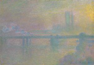A hazy scene showing a bridge over a body of water. There are buildings in the background indicating that this is a cityscape. Blues and pinks convey the fog that covers the golden light from the sun.