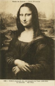 A monochromatic reproduction of Leonardo da Vinci's famous painting called The Mona Lisa. It is a postcard of the painting with text identifying the image and that it comes from the collection of the Louvre. The famous painting shows a three quarter portrait of a young woman in a dark dress. She has her arms folded one on top of the other in front of her and she has a small smile on her face. There is a landscape with trees in the distnace behind her.