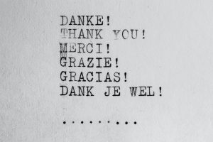 The word for “thank you” typed out in German, English, French, Italian, Spanish and Dutch.