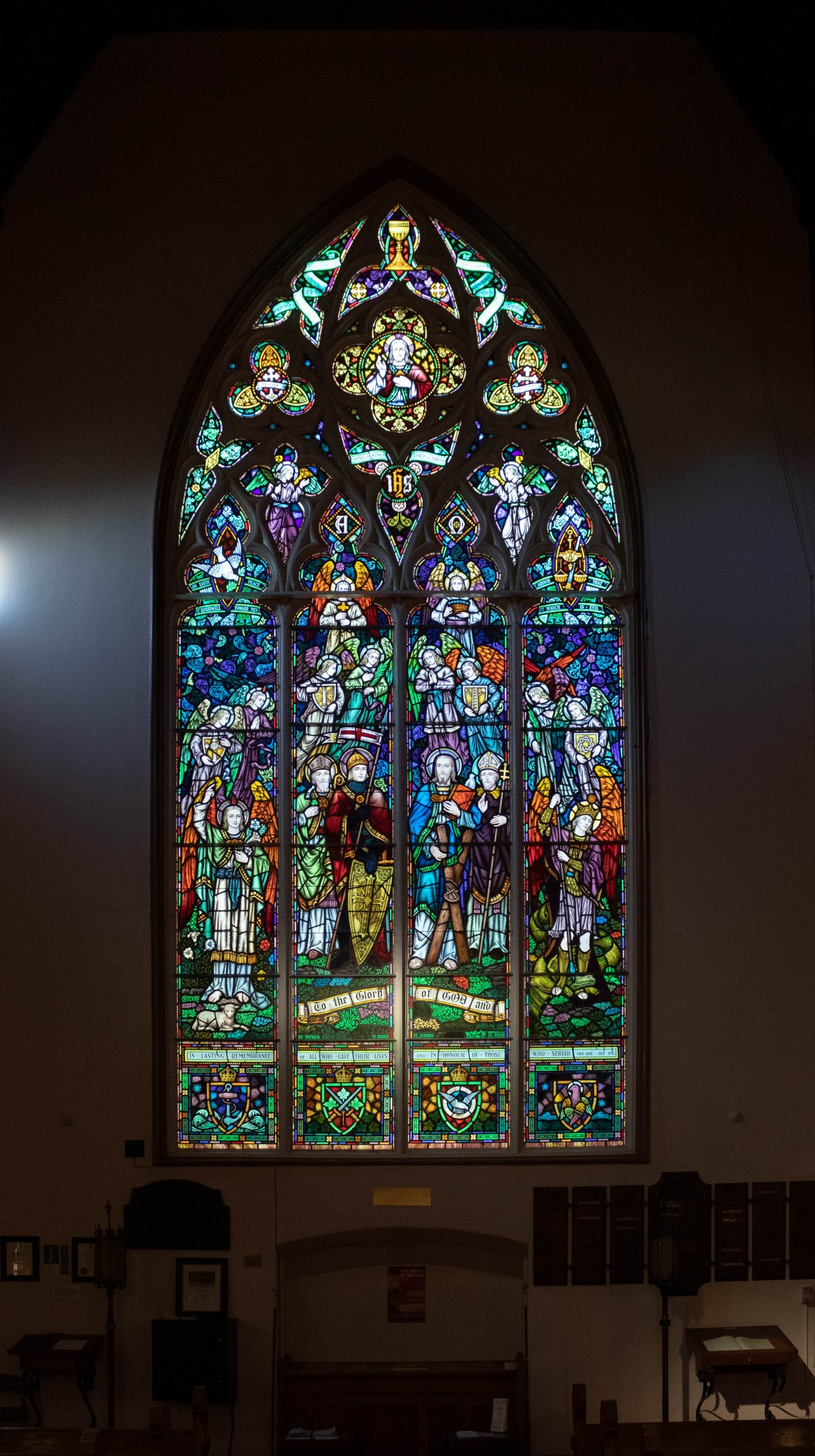 large stained glass window. has many historical figures