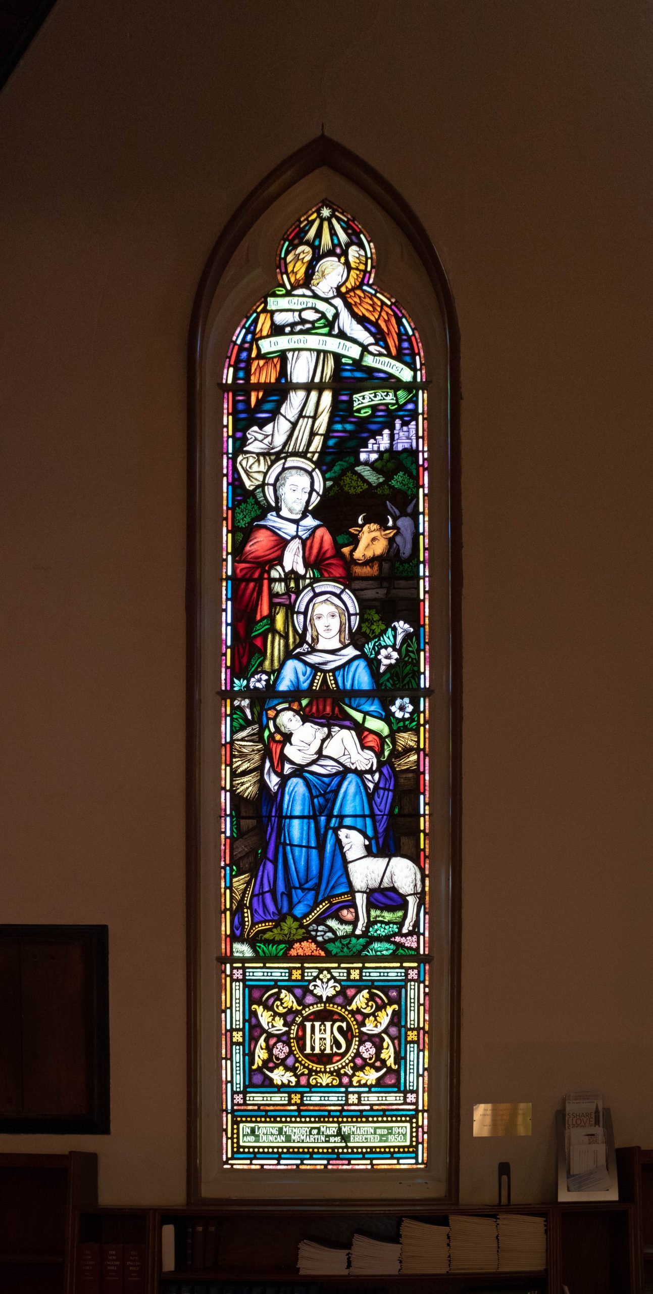 window with two adults and a child