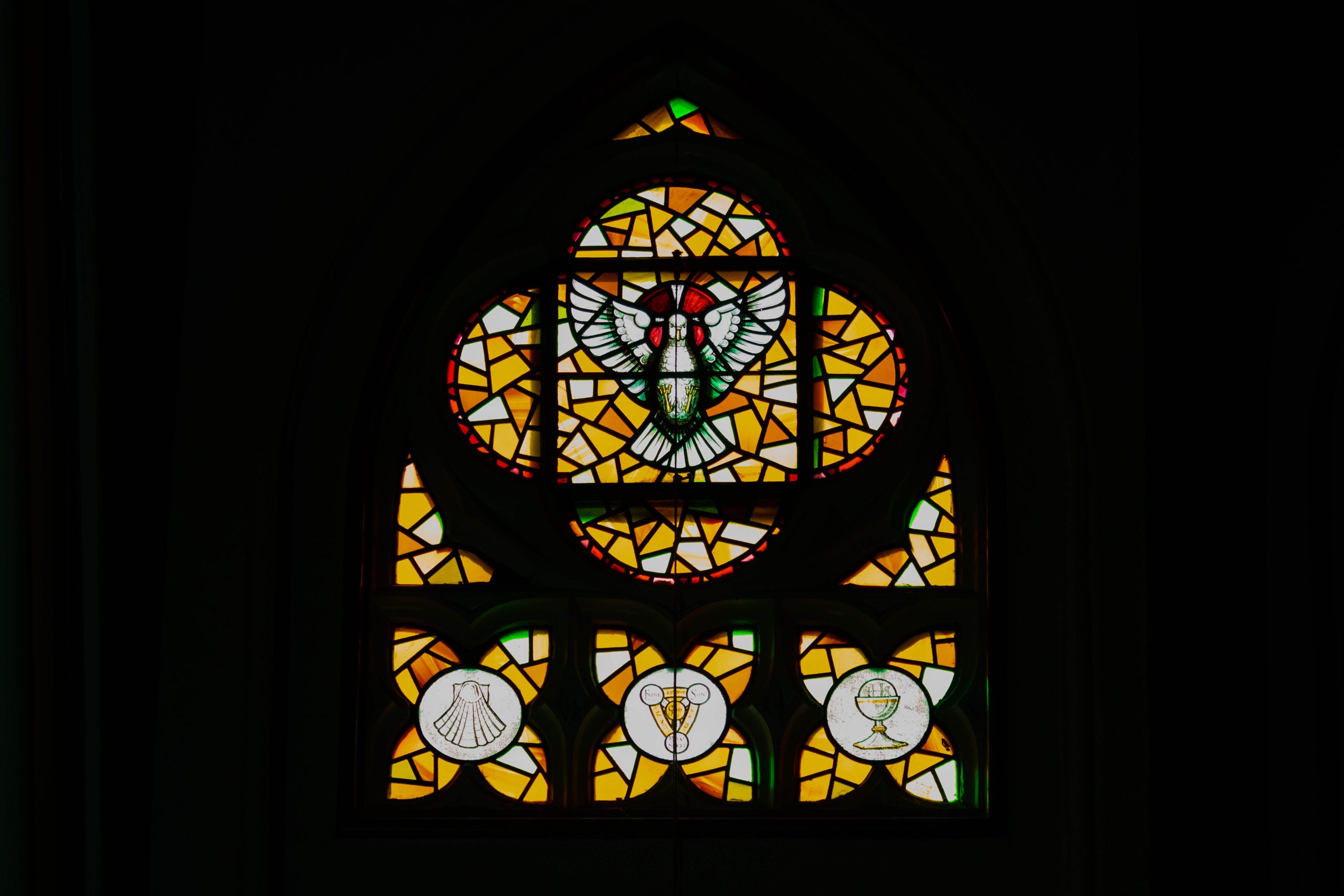 Stained glass window with dove.