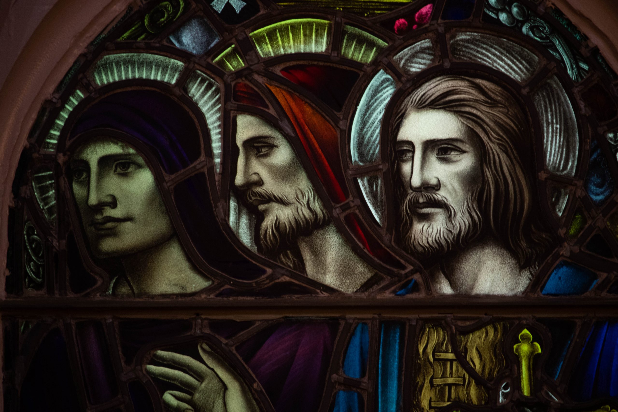 Detail of three men one of which is beardless.