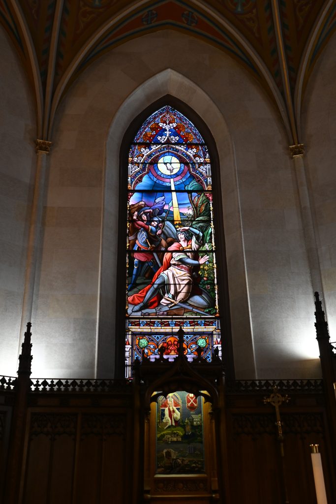 stained glass showing reclining St Paul being converted to Christianity 