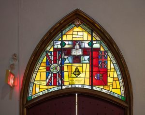 Transom Window showing flags and texts.