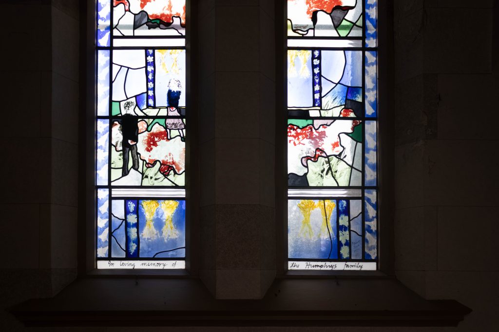 painted glass windows in red, blue, and yellow.