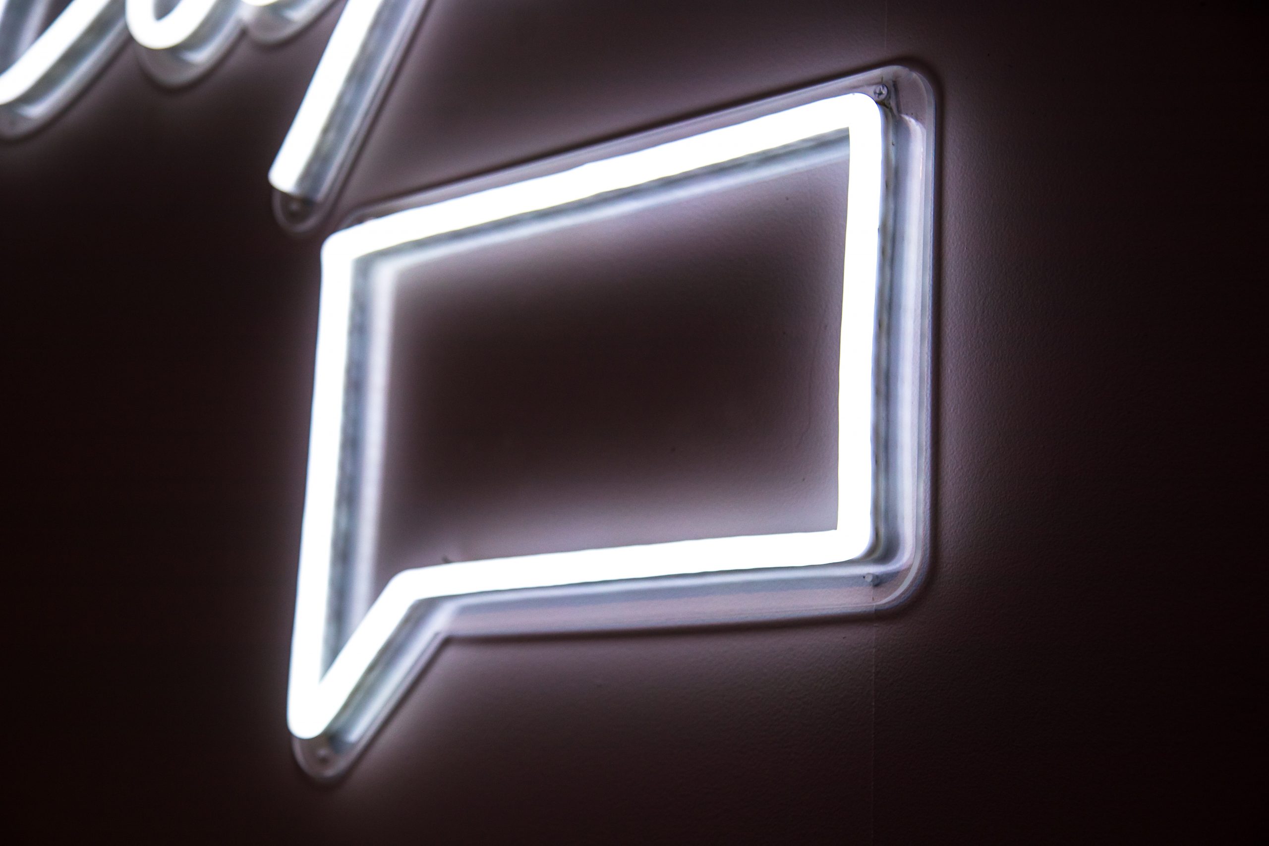 Neon sign of a chat box