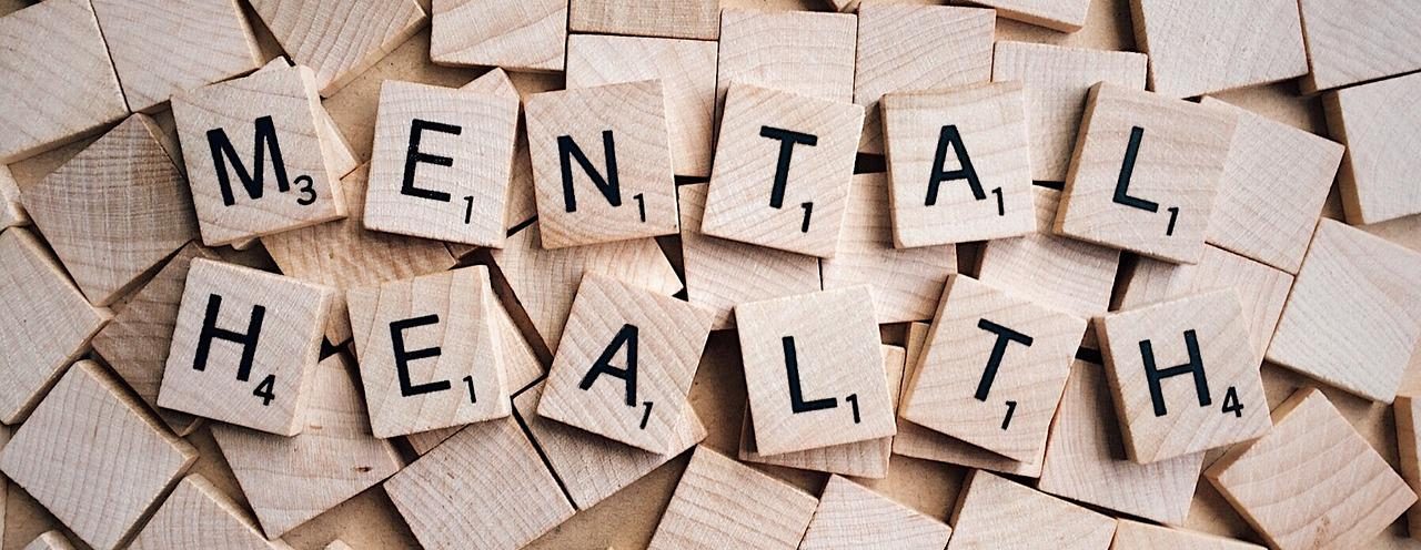 Scrabble squares with the letters for mental health