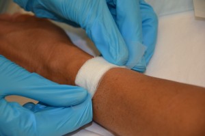 Apply sterile gauze over IV insertion site