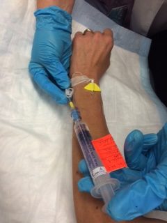 Inject medication into saline lock