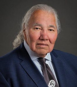 Photo of Justice Murray Sinclair looking at the camera, wearing a suit and tie