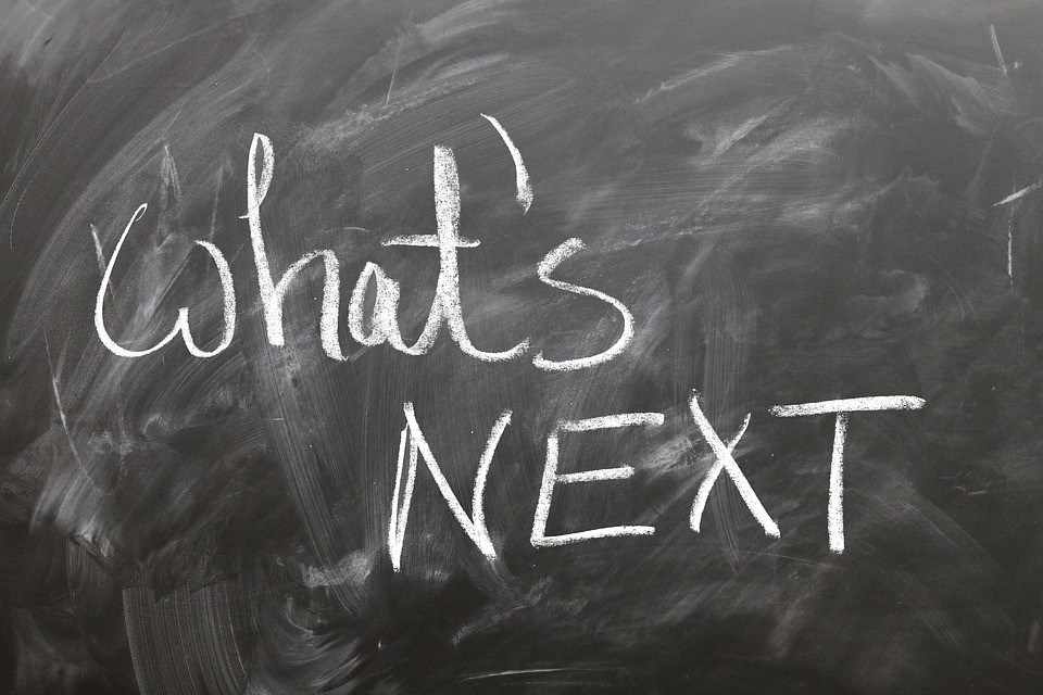 a chalkboard with "what's next?" written on it