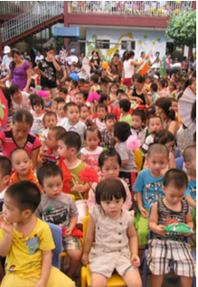 Group of children sitting close to each other