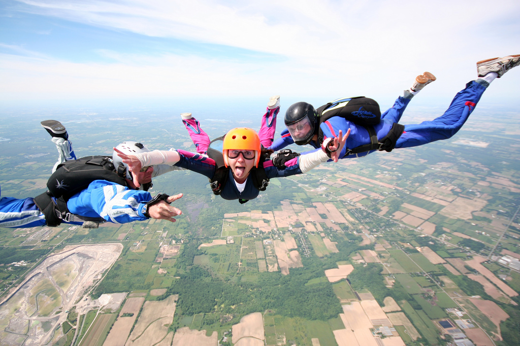 group of 3 people skydiving