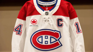 A Canadiens hockey jersey with the air canada logo on the left side.