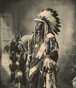 an Indigenous person in traditional clothing