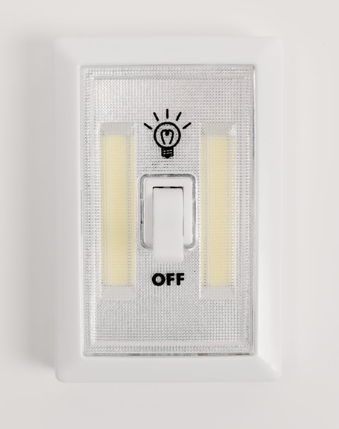 Light switch showing the on and off position. The light blub symbol represents the on position.