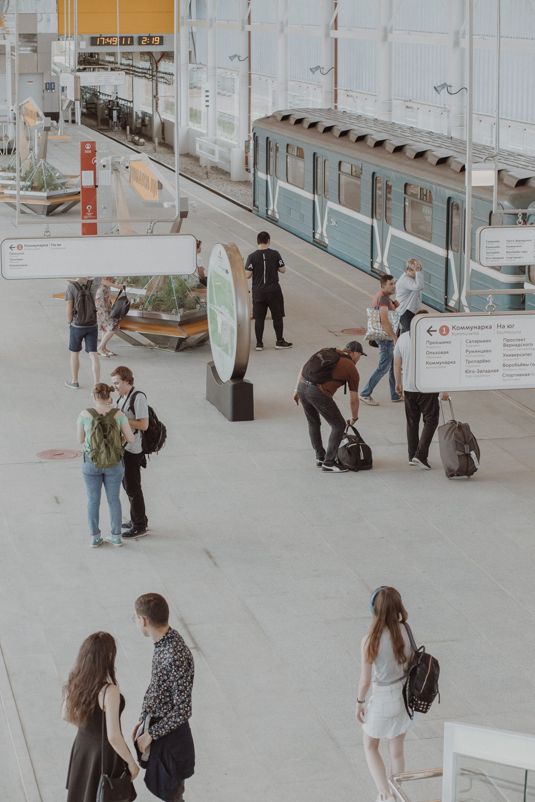 Unrecognizable people in subway platform near train