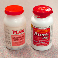 Two Tylenol bottles, side by side. The one on the left has old packaging, while the one on the right is new, tamperproof packaging.