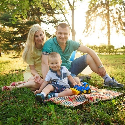 family on picnic blanket