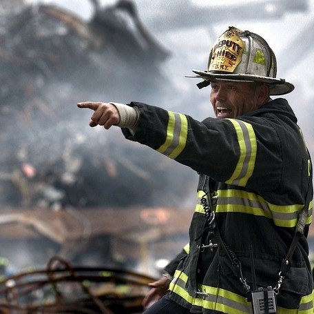 fireperson in action pointing off frame