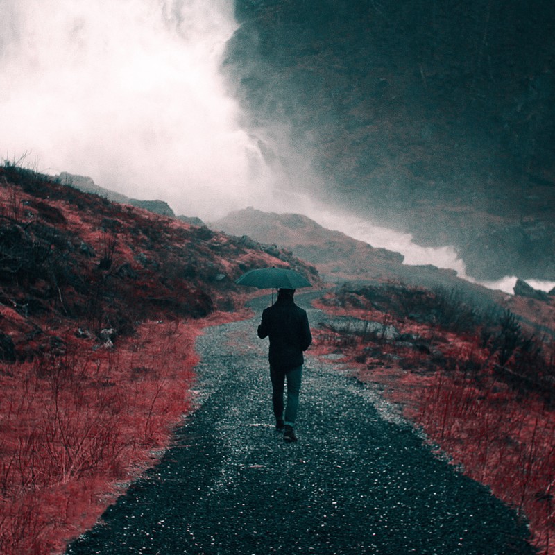 person walking on abandoned road