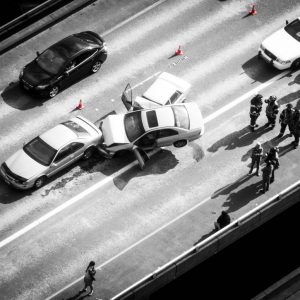 black and white photo from above a multi-car crash on the highway
