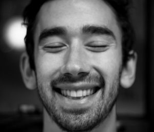 Black and white photo of man smiling