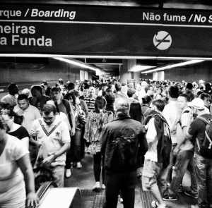 black and white photo of people in an airport