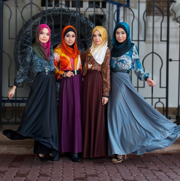 photo of four women in traditional cultural clothing