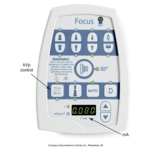 A control panel of a dental X-ray unit named "Focus", displaying buttons for various functions and indicators including kilovoltage (kVp) and milliamperage (mA) settings.