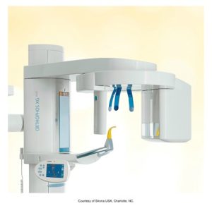 A high-resolution image of an advanced panoramic dental X-ray unit, showcasing various elements like the patient positioning system and the X-ray imaging components. The machine is designed for comprehensive dental diagnostics with emphasis on ease of use and precise imaging.