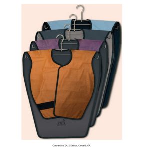 A set of three dental lead aprons on hangers, in different colors (orange, blue, and purple), used for patient protection during X-ray procedures.