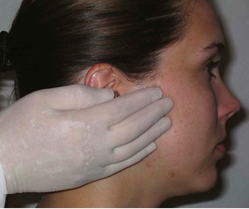 a young woman having her facial lymph nodes examined